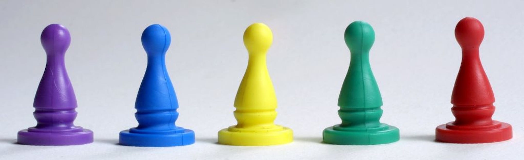 Game pawns for possible use in rating system for board game story.