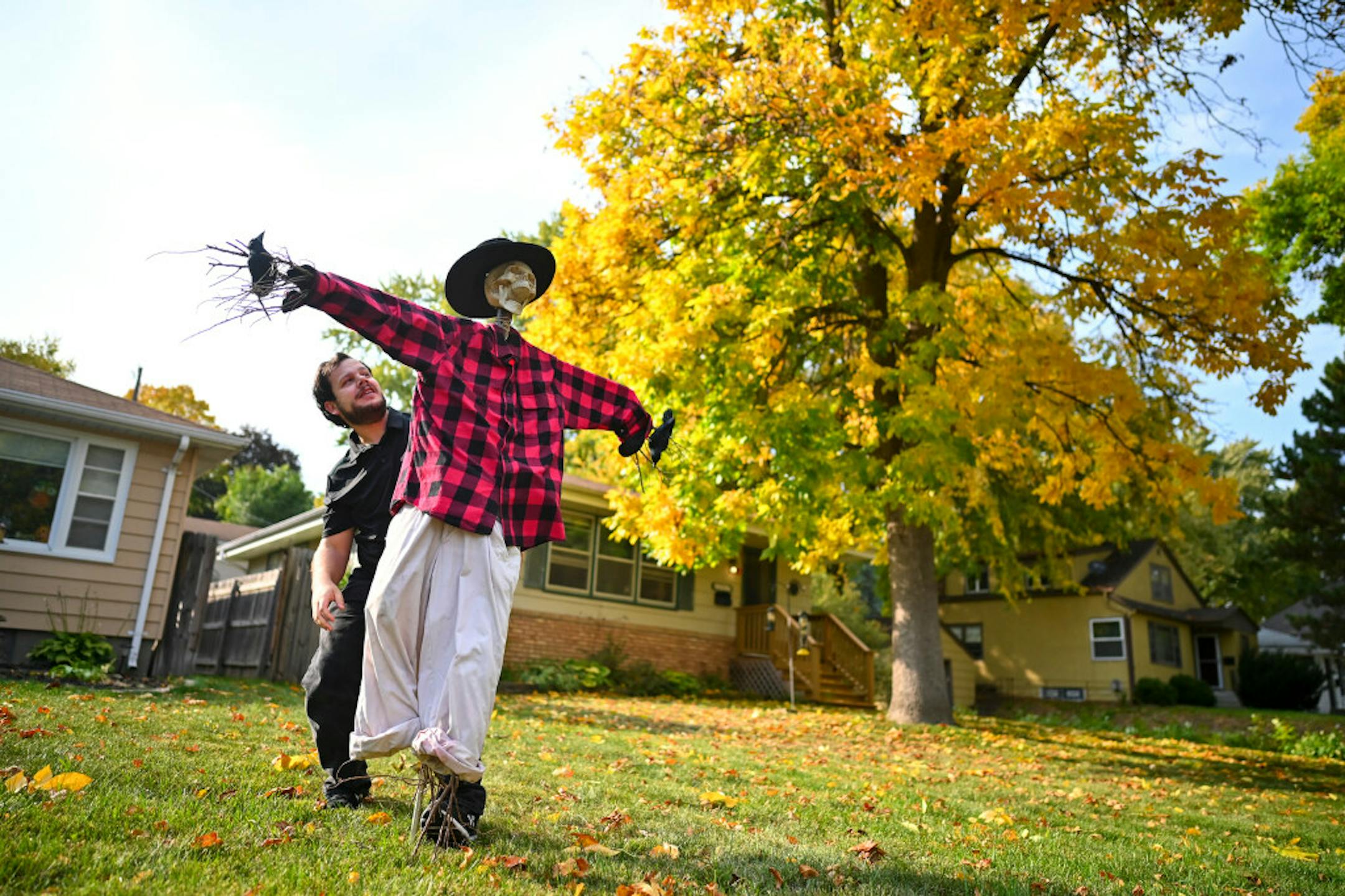 Andrew Tiegs of Robbinsdale worked on putting up his hand-made skeleton scarecrow in his front yard late last month. He's also got a hand-maid giant spider and wraith to put out for his favorite holiday of the year. "If just having a cool-looking house is all I can do, that's enough," he said.