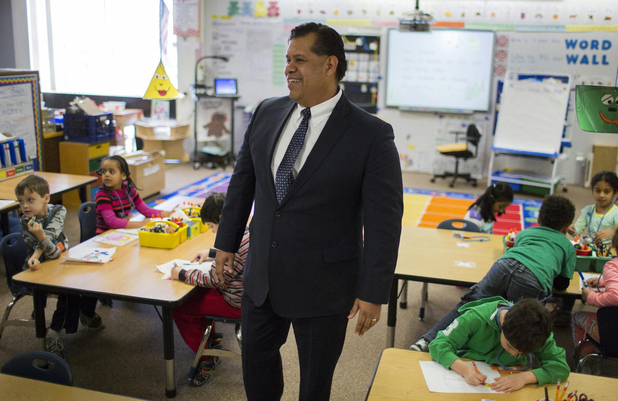 John Garcia, principal of Cedar Park STEM school in Apple Valley, chats with kindergartners before the start of school. ] Since Garcia has been at the helm, the school, considered racially identifiable by the state with more than half of students receiving free/reduced lunch, has made a dramatic shift. Once, no one wanted to say they taught or attended the school, Garcia said, and now it's a place of pride, winning many honors, including "Celebration School" status by the state. BRIAN PETERSON &