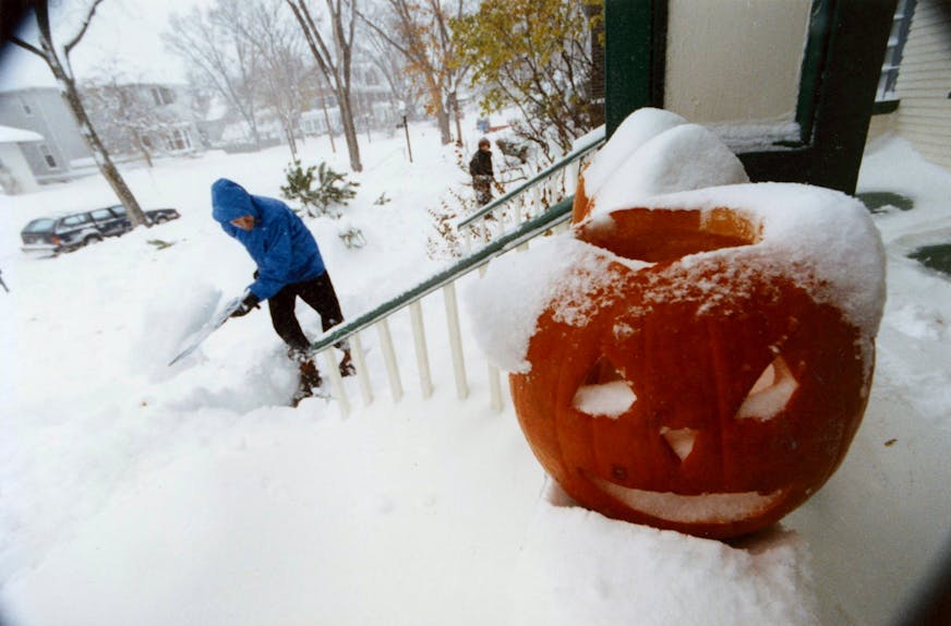 Nov. 1, 1991: John Floberg shovels out his walk on James Av. S. in Minneapolis after the infamous Halloween blizzard of 1991. Photo by Rick Sennott.