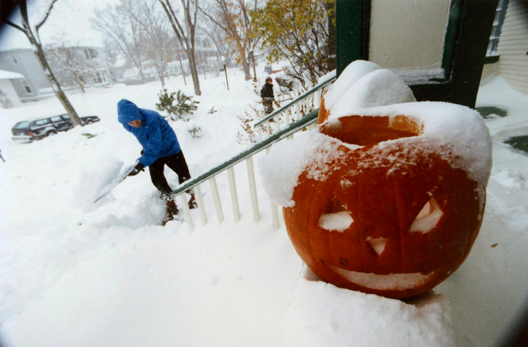 Nov. 1, 1991: John Floberg shovels out his walk on James Av. S. in Minneapolis after the infamous Halloween blizzard of 1991. Photo by Rick Sennott.
