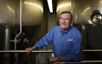 In New Ulm at the August Schell Brewery, Ted Marti is the fifth generation brewer. He is standing next to one of the modern brewing vats.] rtsong-taat