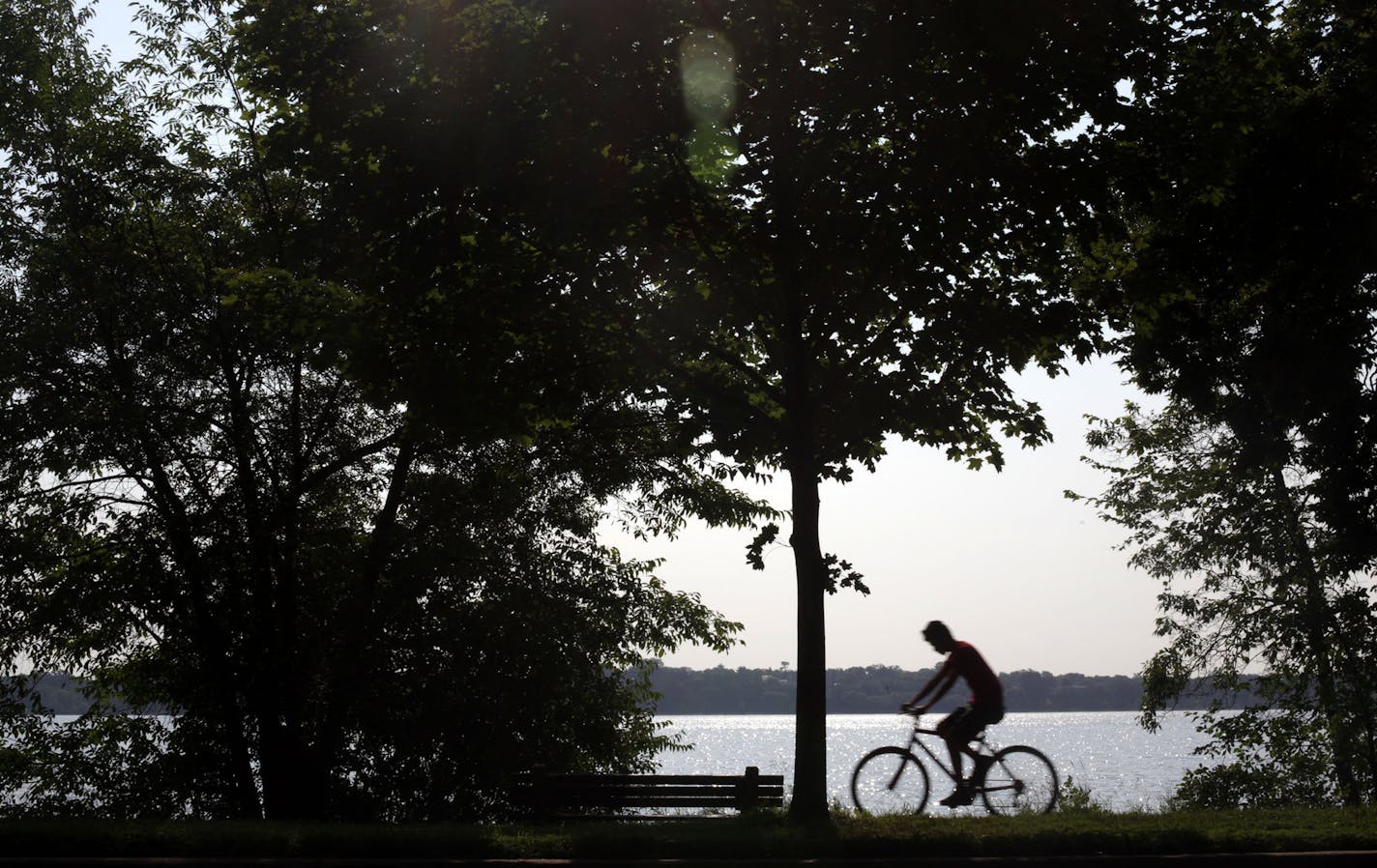 Despite the rising heat, bikers, runners, and walkers still enjoyed the Lake Calhoun trails on Monday morning.] MONICA HERNDON monica.herndon@startribune.com Minneapolis, MN 07/21/14