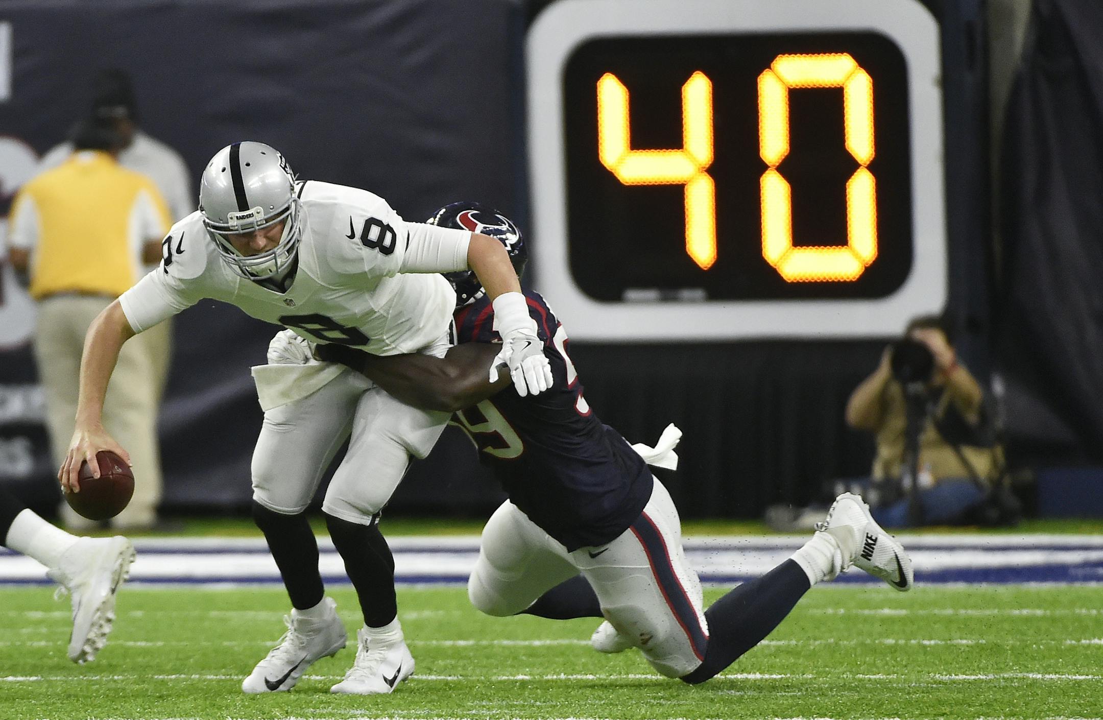 Houston Texans outside linebacker Whitney Mercilus (59) sacks Oakland Raiders quarterback Connor Cook (8) during the second half of an AFC Wild Card NFL game Saturday, Jan. 7, 2017, in Houston. (AP Photo/Eric Christian Smith) ORG XMIT: TXMS1