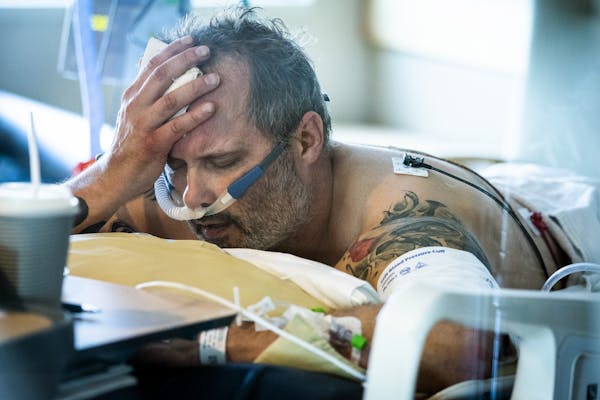 COVID-19 patient Michael Wright has improved since Thursday, when he lay in his bed in the prone position to increase oxygenation while at Regions Hos