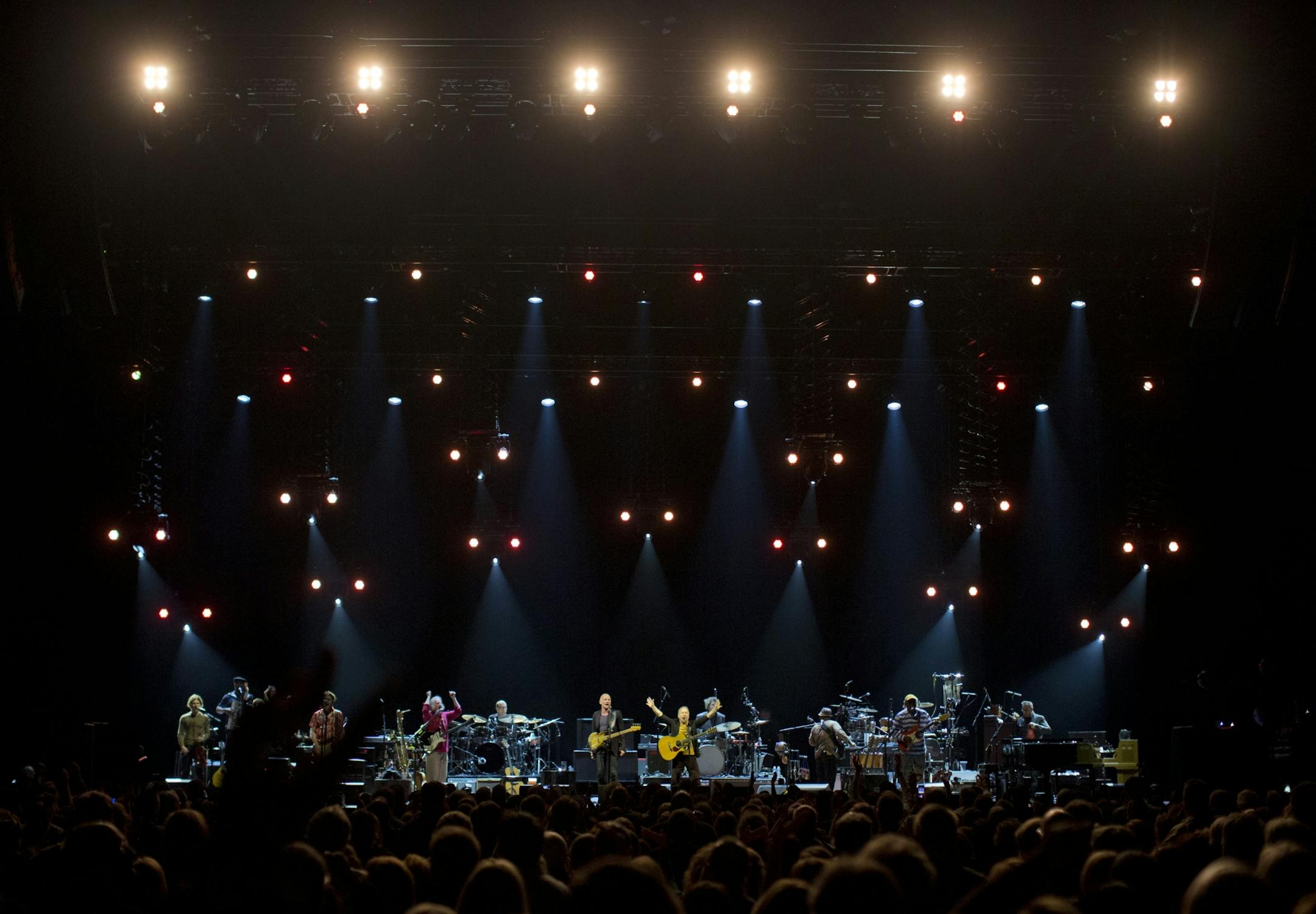 Longtime New York neighbors Sting and Paul Simon decided to hit the road and tour together. The Paul Simon & Sting: On Stage Together tour stopped at Xcel Energy Center in St. Paul Sunday night, February 23, 2014. Sting, left, and Paul Simon performing Simon's "Boy in the Bubble" early in their set Sunday night at Xcel Energy Center.