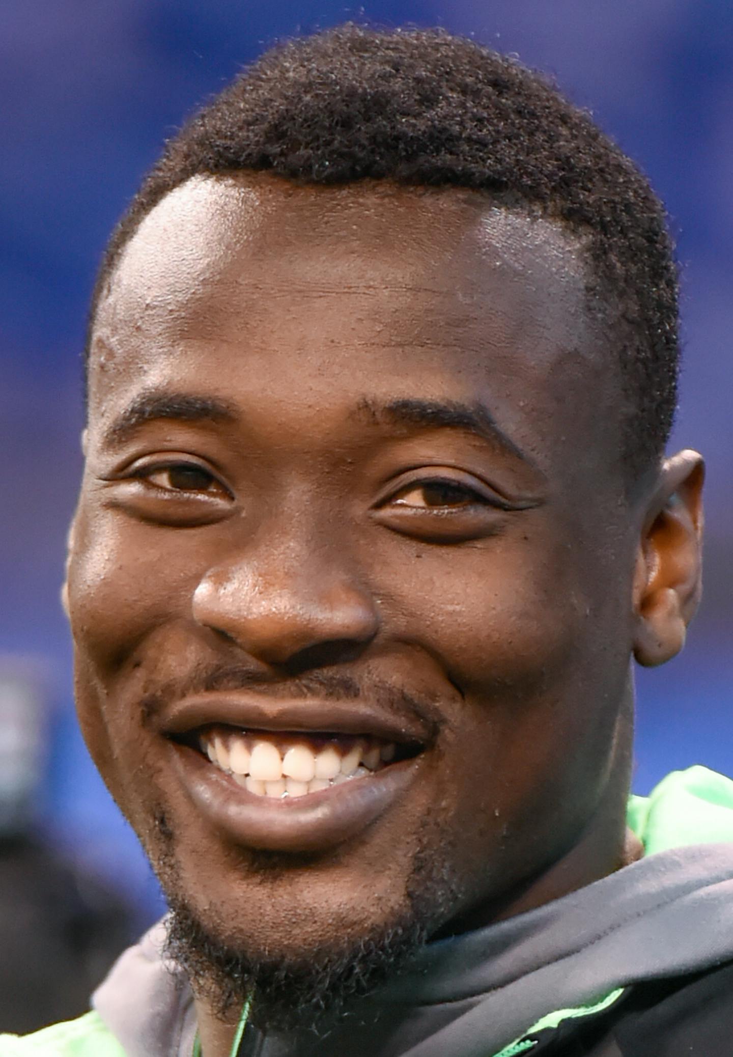 Clemson defensive back Mackensie Alexander laughs while watching players workout at the NFL football scouting combine, Monday, Feb. 29, 2016, in Indianapolis. (AP Photo/L.G. Patterson)