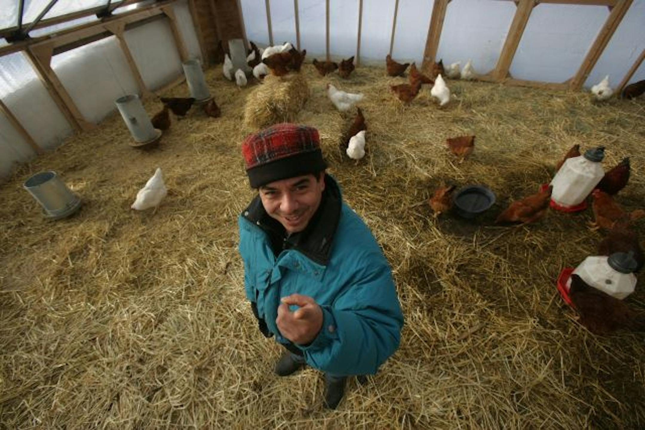 Agronomist Reginaldo Haslett-Marroquin has a solar-heated "hoop house" on his farm that lets him raise organic, free-range chickens year-round.