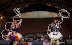 Sam Sampson (left) and Micco Sampson (right) perform a hoop dance.