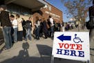 This Nov. 4, 2008, photo provided by MinnPost shows young voters waiting to cast ballots at a polling place in Minneapolis. If millennials, currently 