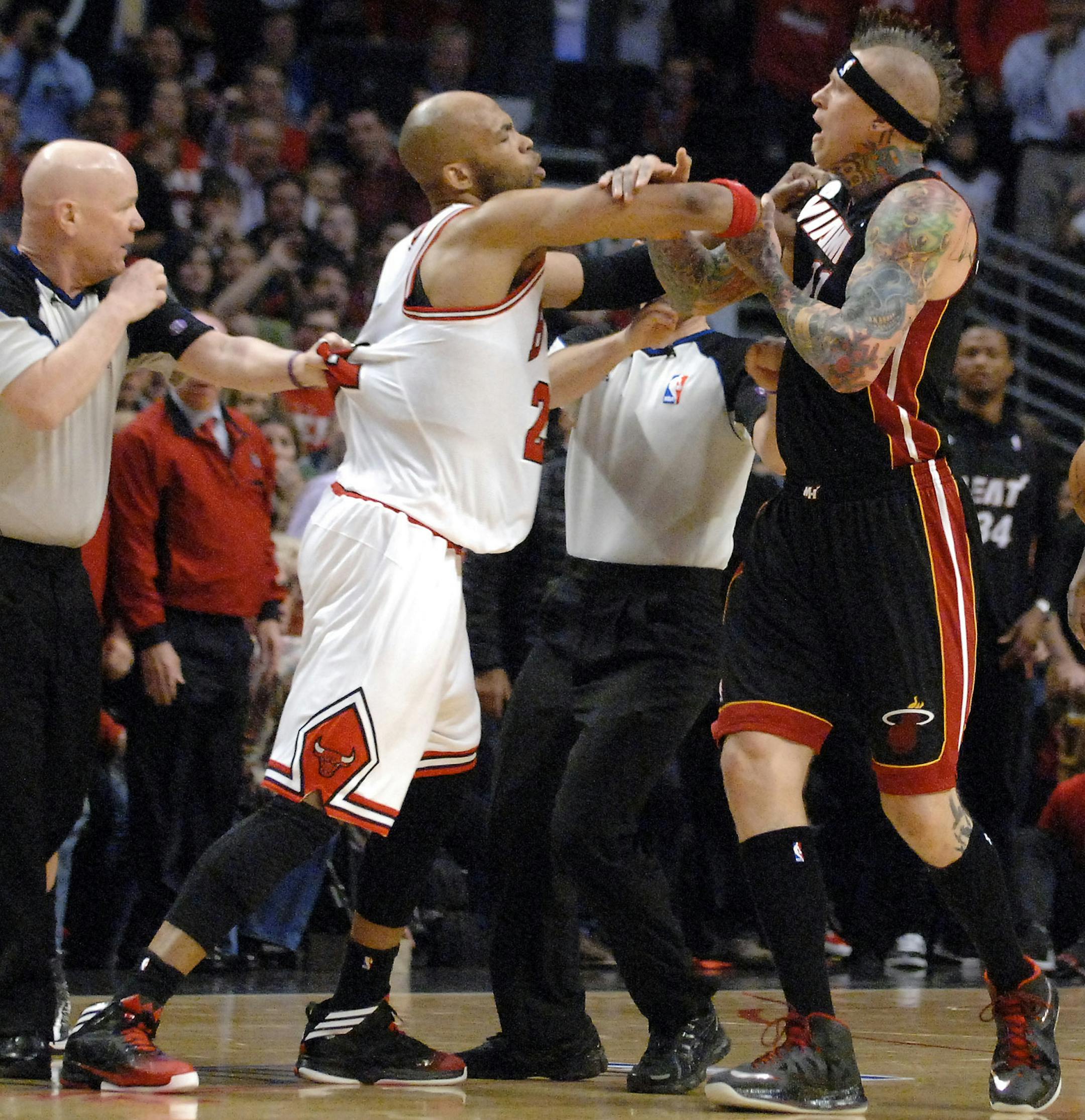Chicago Bulls power forward Taj Gibson (22) and Miami Heat power forward Chris Andersen (11) get in a shoving match following Nazr Mohammed foul on LeBron James during Game 3 of an NBA basketball playoffs Eastern Conference semifinal on Friday, May 10, 2013, in Chicago. The Heat won 104-94. (AP Photo / Daily Herald, Rick West) MANDATORY CREDIT, MAGS OUT, TV OUT
