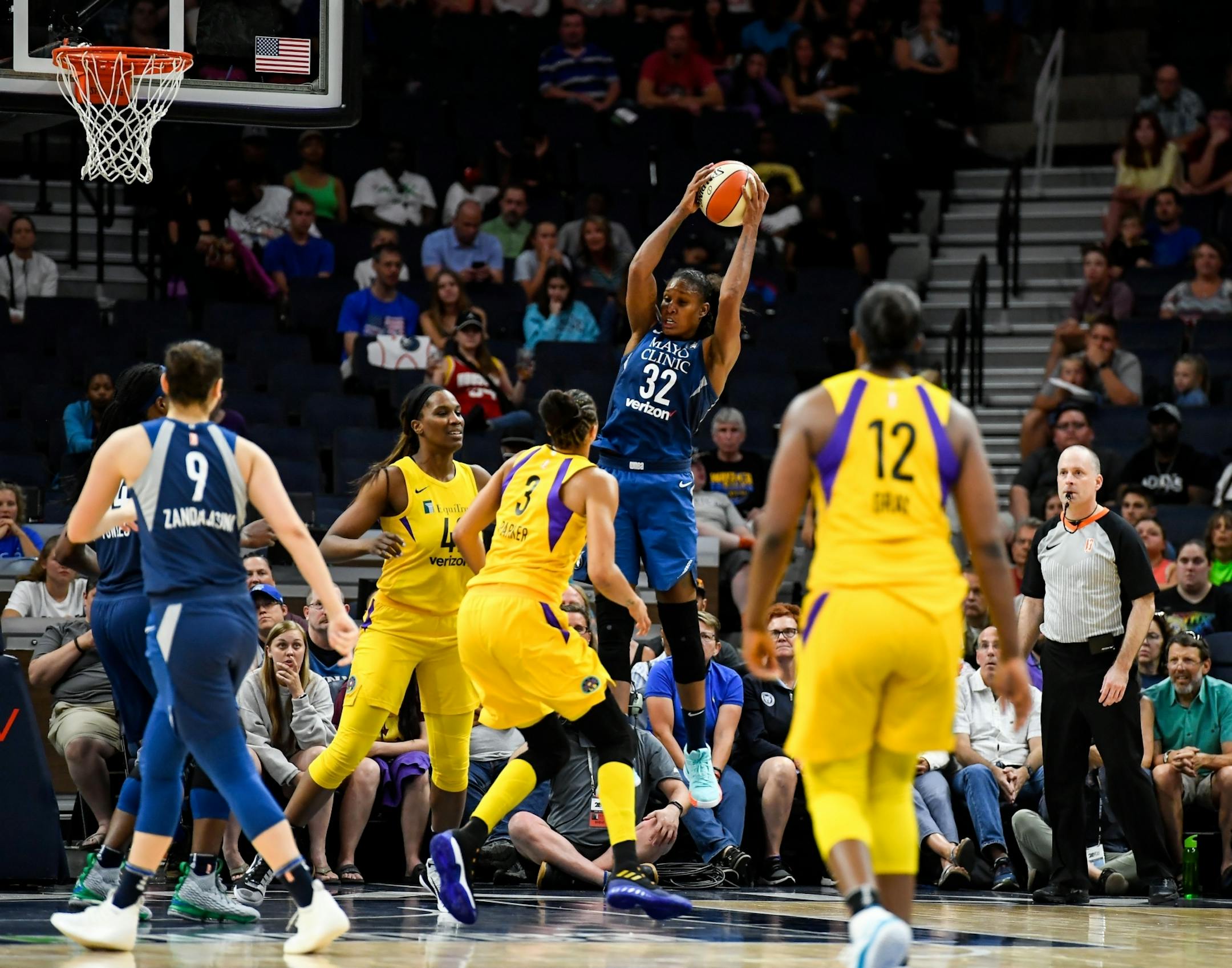 Minnesota Lynx forward Rebekkah Brunson (32) pulled down a rebound late in the fourth quarter against the Los Angeles Sparks. She became the second-all time rebounder in WNBA history, passing Lisa Leslie.
