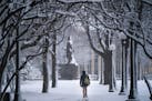 ] LEILA NAVIDI &#x2022; leila.navidi@startribune.com BACKGROUND INFORMATION: A woman walks out of the State Office Building in St. Paul as the snow st