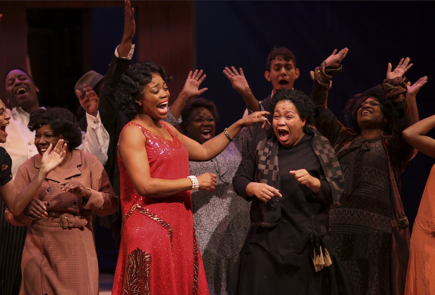 Aimee K. Bryant as Celie reacted to her first taste of alcohol while in a scene with Regina Marie Williams' Shug Avery during rehearsal of the first act of "The Color Purple."