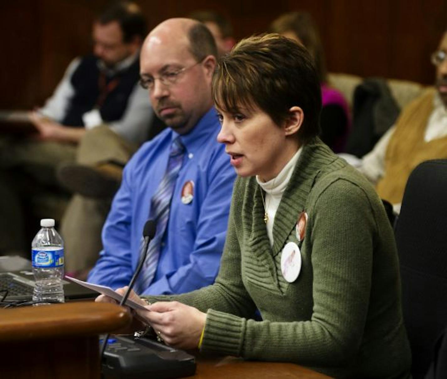 Lynn, front, and Travis Johnson told the House Public Safety and Crime Prevention Policy and Finance Committee about their 2-year-old daughter's death at the hands of a 13-year-old.