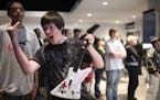 Bryson Watt of Maplewood struck a pose as he began to rock out on Guitar Hero: Metallica at a radio station's booth in the Target Center lobby Tuesday