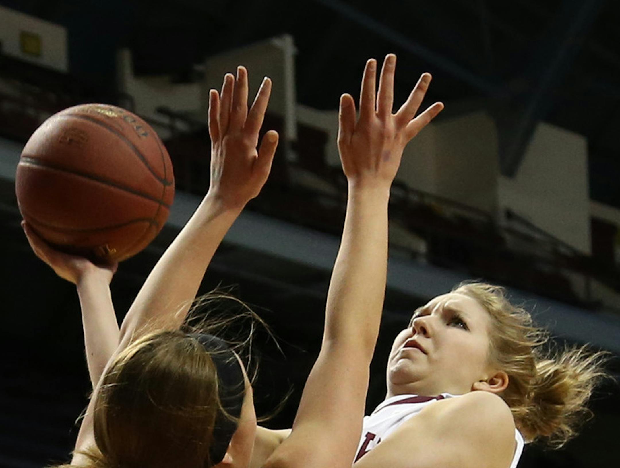 Sauk Center's Kelsey Peschel drove to the basket and Dover-Eyota's Danielle Higgins got called for the foul during the first half. ] (KYNDELL HARKNESS/STAR TRIBUNE) kyndell.harkness@startribune.com Class 2A girls' basketball finals Dover-Eyota vs Sauk Center at Williams Arena in Minneapolis Min., Saturday, March 21, 2015.