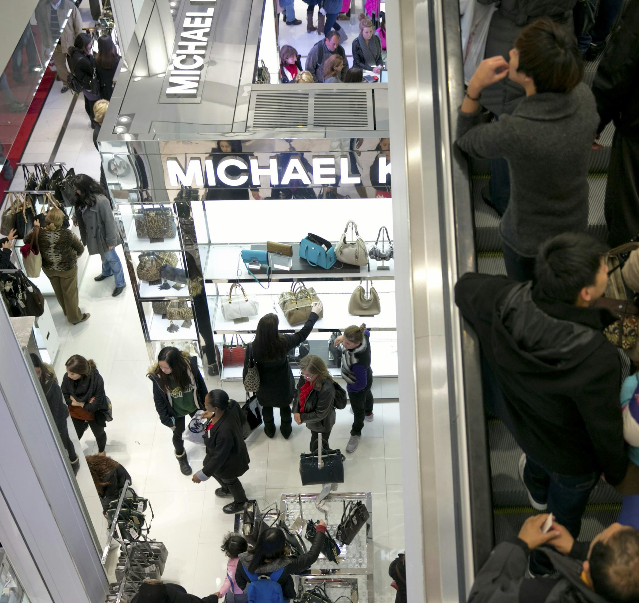 People crowd Macy's as they shop for Black Friday deals early Friday morning, in New York, Nov. 23, 2012. Analysts and investors pay a lot of attention to Black Friday figures in hopes of gaining insight into the consumer psyche, but it is not clear how much Black Friday activity actually tells us about the underlying health of the economy. (Marcus Yam/The New York Times)