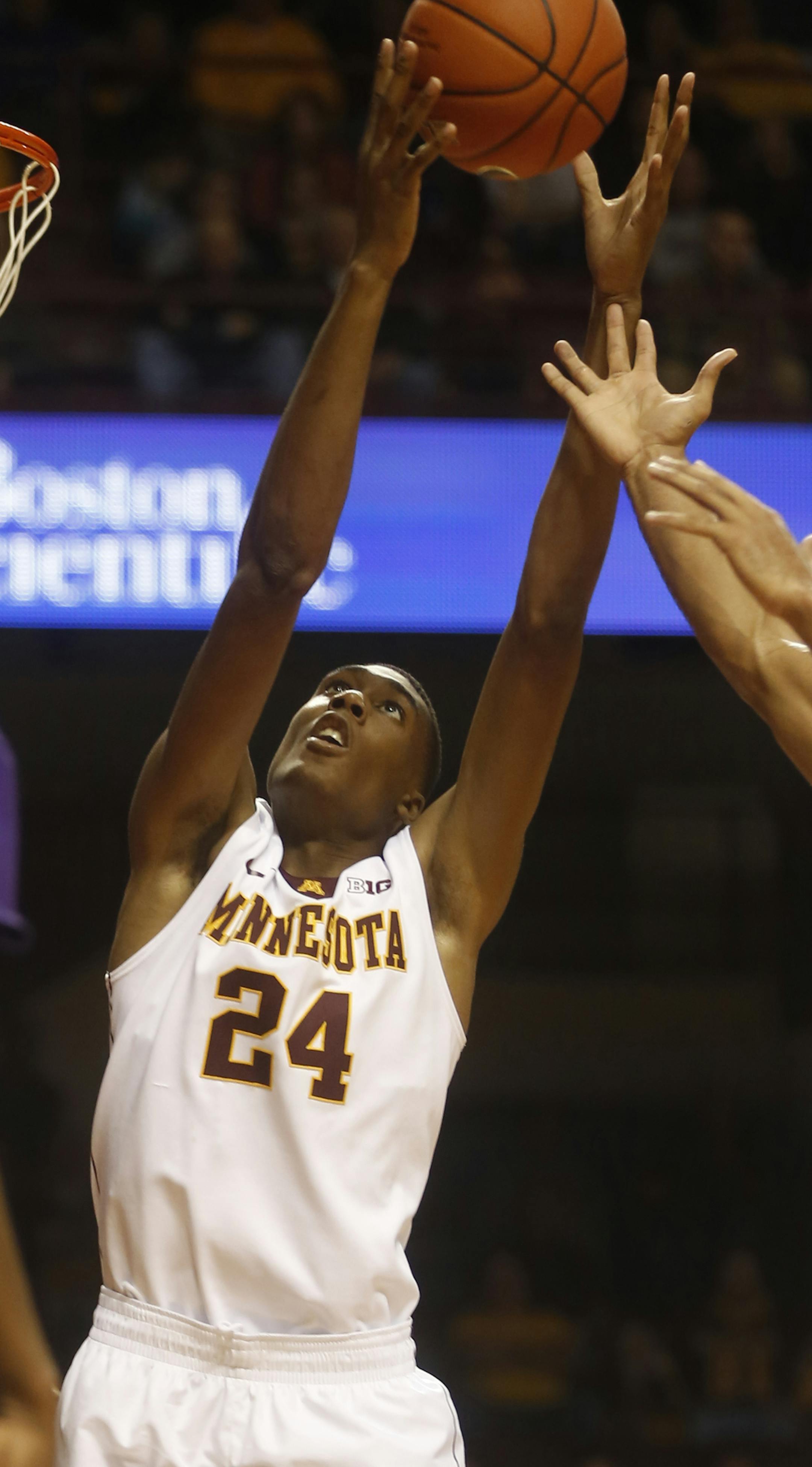 In a preseason game between the Minnesota Gophers and the Southwest Baptist Bearcats, Charles Buggs(24)grabbed a defensive rebound in the first half.] rtsong-taatarii@startribune.com