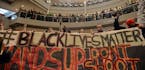 Demonstrators filled the Mall of America rotunda and chanted "Black lives matter" to protest police brutality, Saturday, Dec. 12, 2014, in Bloomington