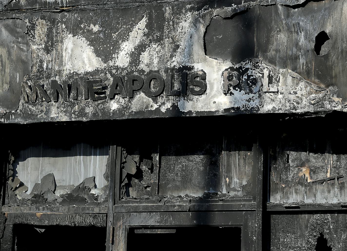 The fire-scared- entrance to the Minneapolis Police 3rd precinct building is shown in the wake of protests in the death of George Floyd, Saturday, May 30, 2020, in Minneapolis, Minn. Floyd was killed in police custody in Minneapolis on May 25. (David Joles/Star Tribune via AP)