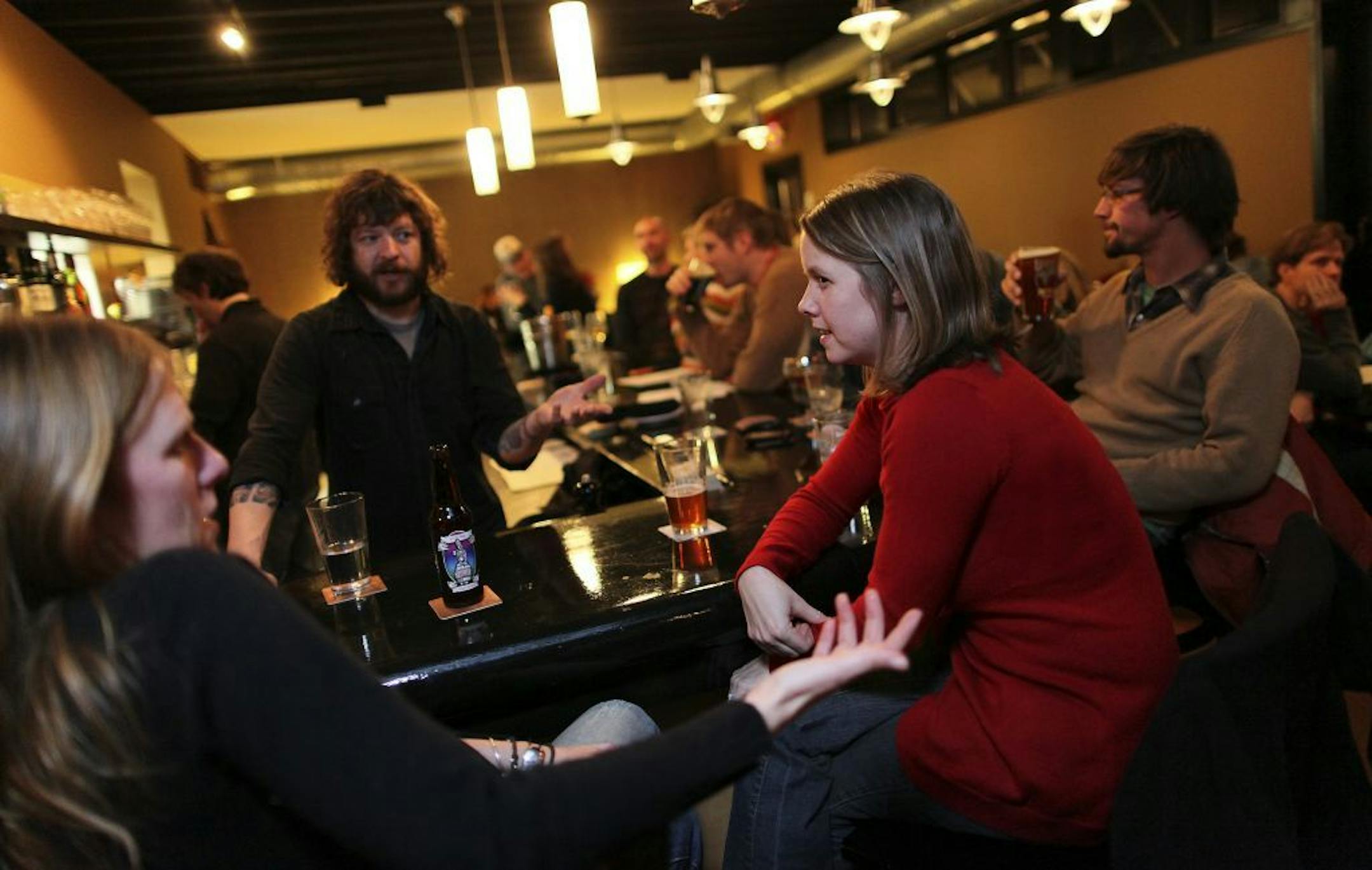 TOM WALLACE � twallace@startribune.com Assign#20010632A Slug: scene1218 Date: December 11, 2009 Kings Wine Bar� part of the Tom Horgan column on bars. 4555 Grand Ave. S., Minneapolis, MN. Left, Julie Pihaly and Dina Carpenter enjoy an evening out and Bartender John Schreiner takes care of their needs at Kings Friday night.
