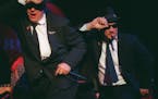 Actors Dan Aykroyd, left, and Jim Belushi perform as the Blues Brothers during the grand opening of the House of Blues restaurant and nightclub Sunday