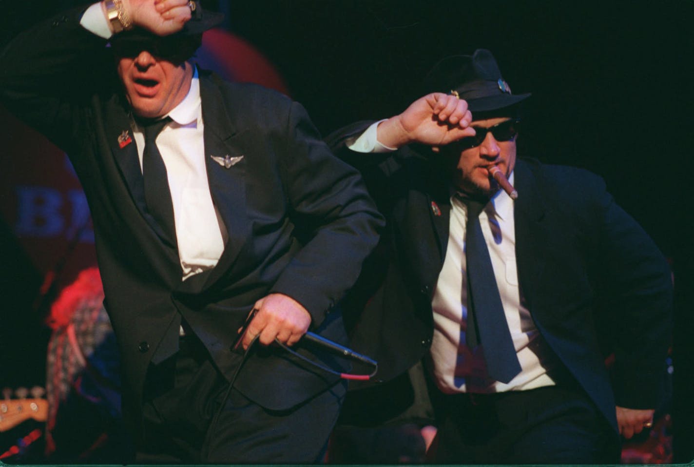 Actors Dan Aykroyd, left, and Jim Belushi perform as the Blues Brothers during the grand opening of the House of Blues restaurant and nightclub Sunday evening, Nov. 24, 1996, in Chicago. Aykroyd and Belushi are investors in the House of Blues chain. (AP Photo/Peter Barreras) ORG XMIT: CX104