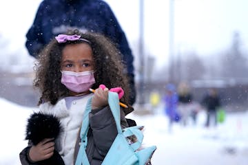 In-person learning returned for kindergarten through second graders at Sonnesyn Elementary School on Tuesday in New Hope. Here, a young student came p