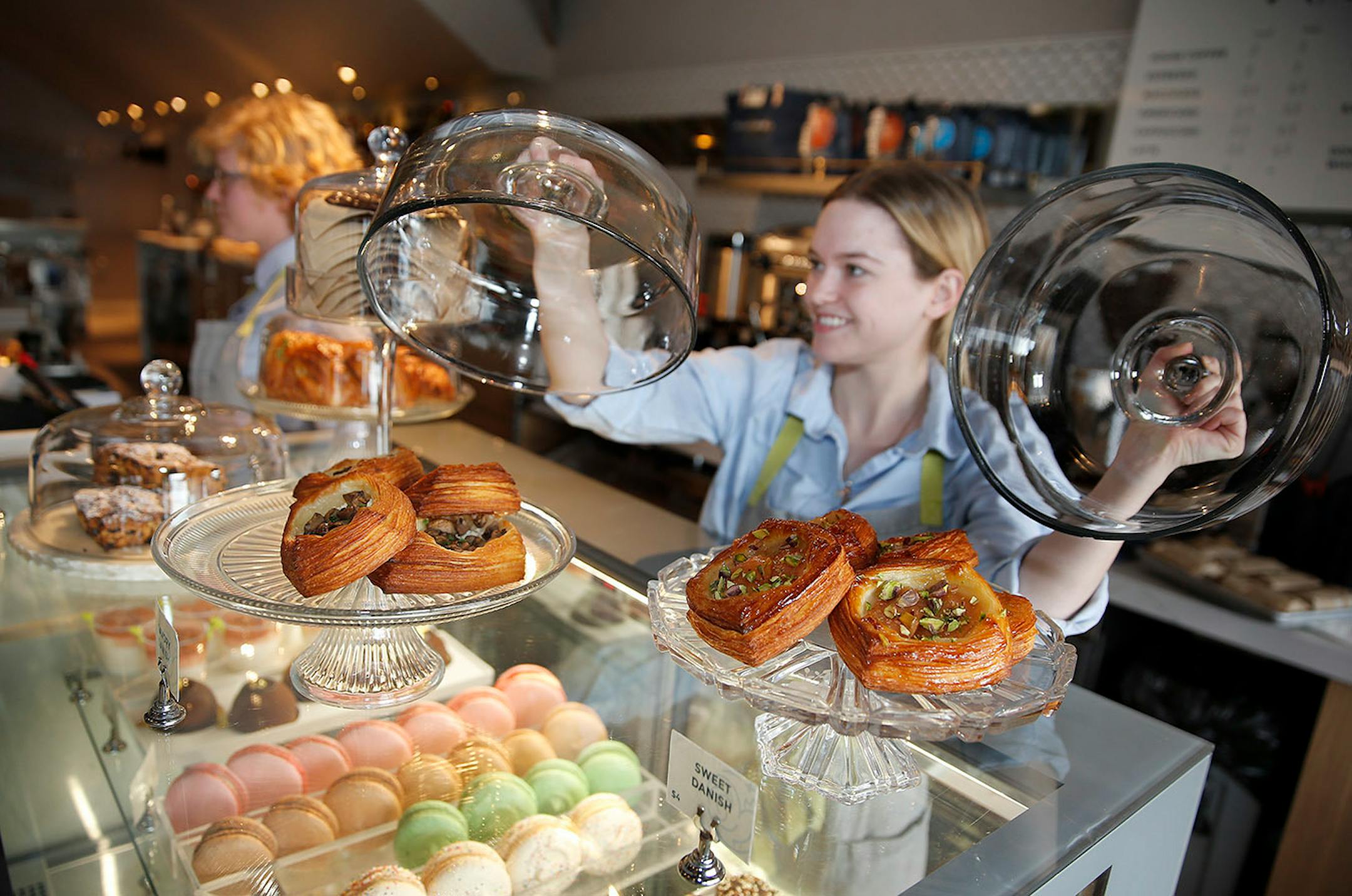 Haley Brennan stocked the bakery display case in the front of the Bellecour in Wayzata.