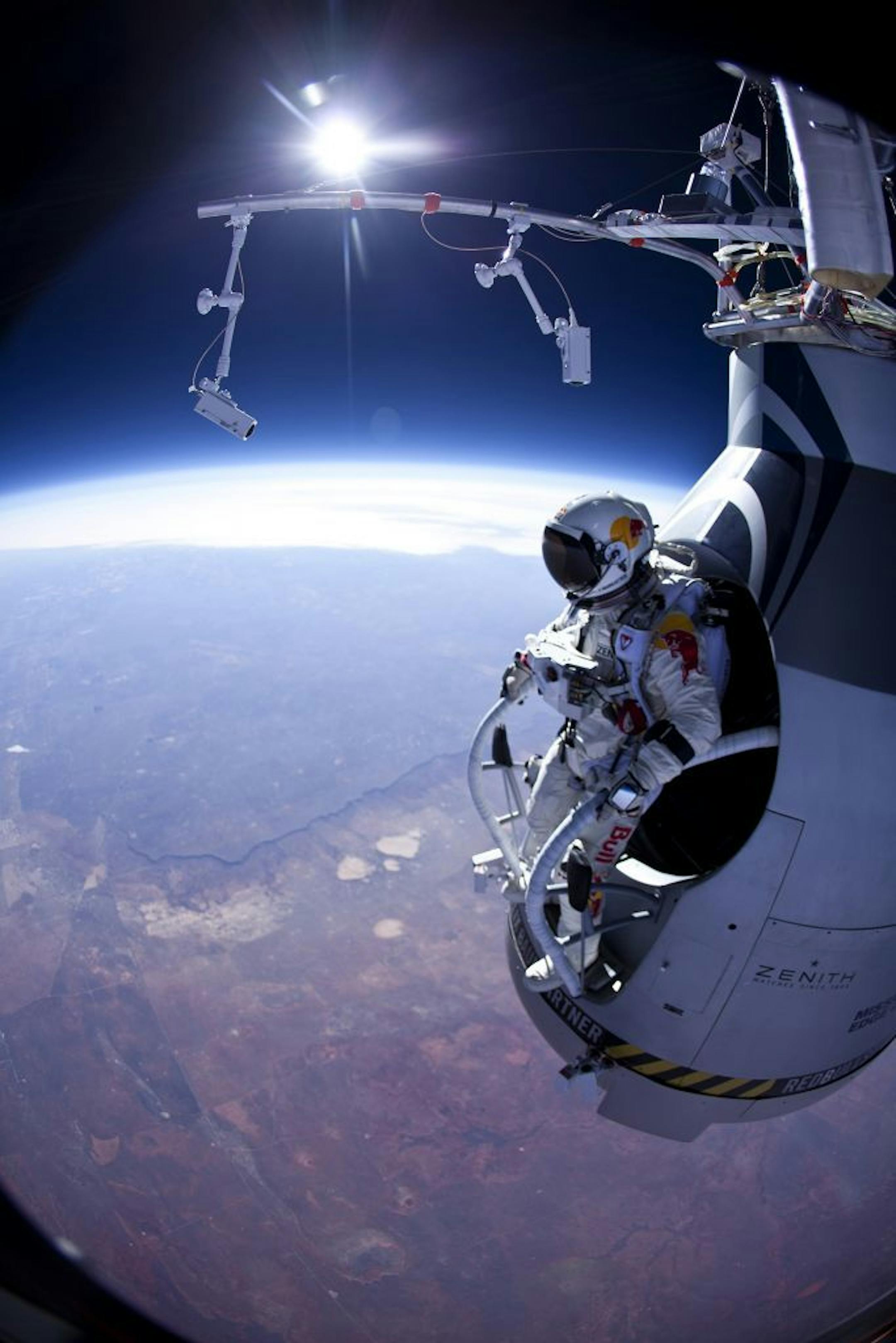 FILE - In this Thursday, March 15, 2012 photo provided by Red Bull Stratos, Felix Baumgartner prepares to jump during the first manned test flight for Red Bull Stratos over Roswell, N.M.