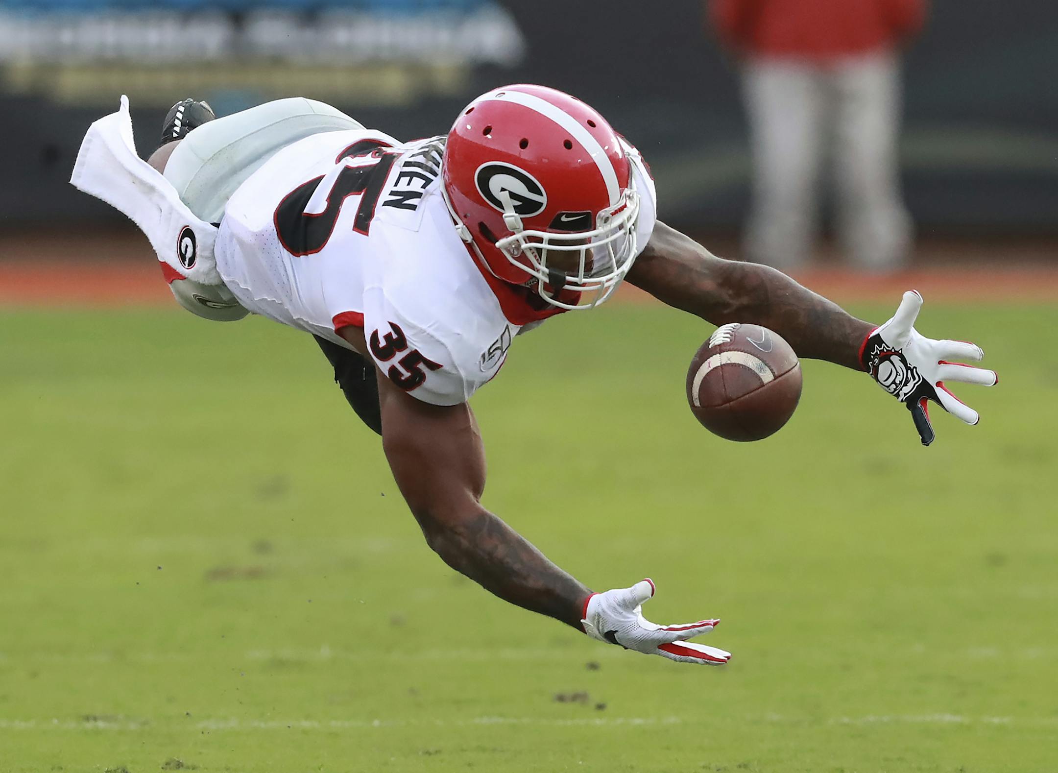 Georgia tailback Brian Herrien makes a diving catch against Florida during the third quarter of an NCAA college football game Saturday, Nov, 2, 2019, in Jacksonville, Fla. (Curtis Compton/Atlanta Journal-Constitution via AP)