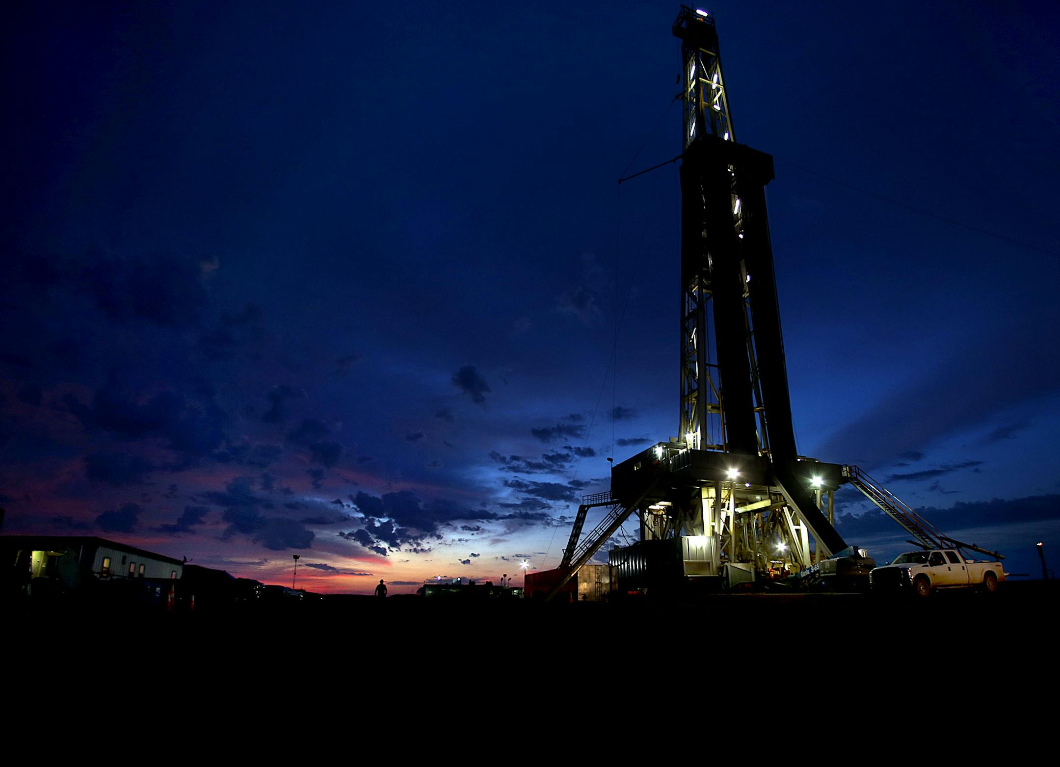Men worked around the clock at Raven Rig No. 1 near Watford City. With the rise in oil production have come economic gains and population growth ranking the highest among U.S. states.