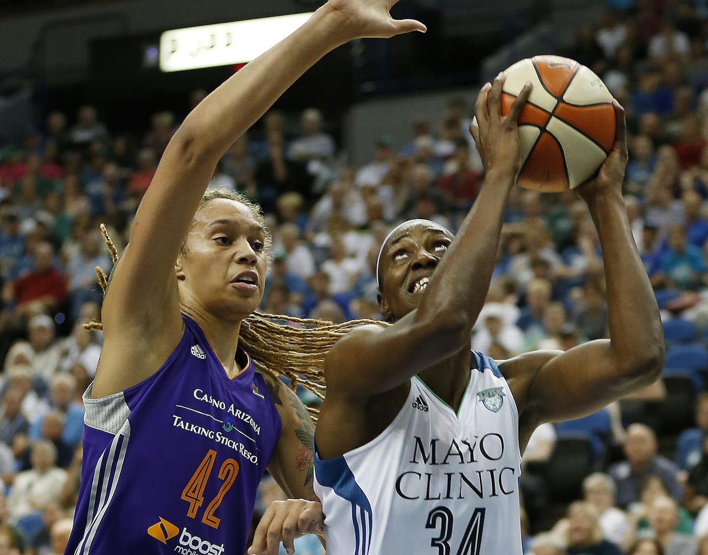 Minnesota Lynx center Sylvia Fowles (34) drives against Phoenix Mercury center Brittney Griner (42) during the first half of a WNBA basketball game, Sunday, Aug. 30, 2015, in Minneapolis. (AP Photo/Stacy Bengs)