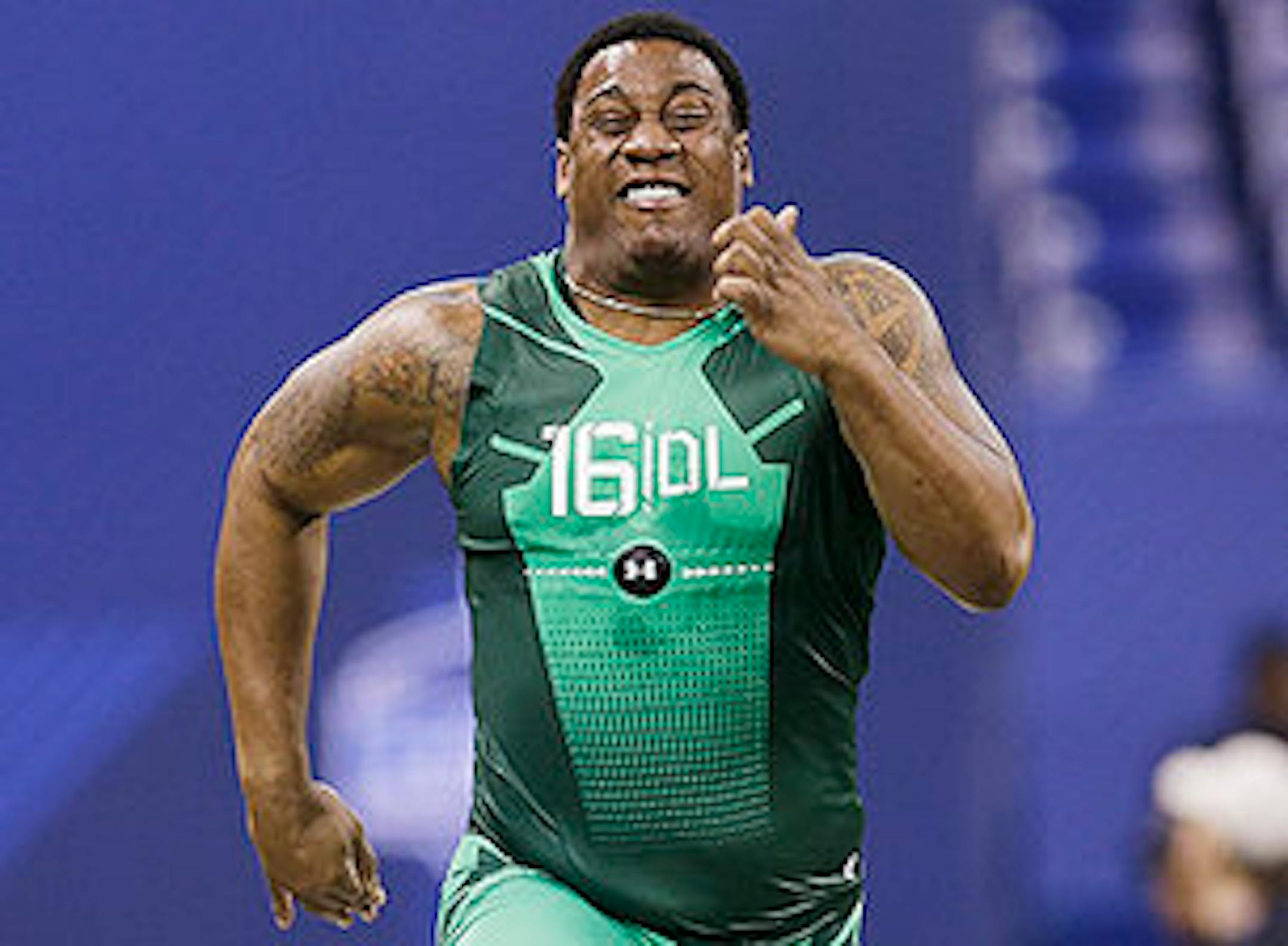 Louisville defensive lineman B.J. Dubose runs the 40-yard dash at the NFL football scouting combine in Indianapolis, Sunday, Feb. 22, 2015. (AP Photo/David J. Phillip)