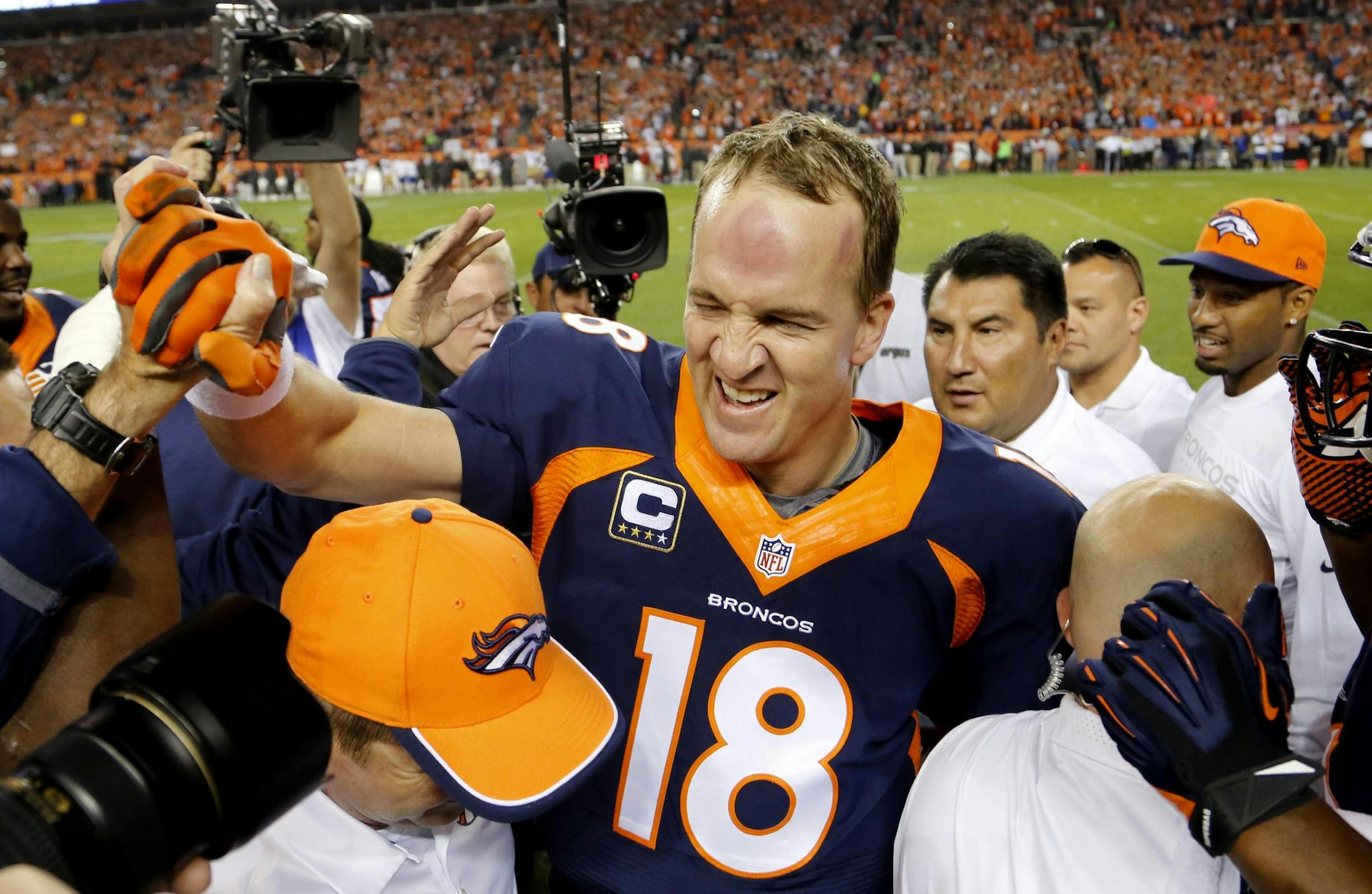 Broncos quarterback Peyton Manning celebrated his 509th career touchdown pass with teammates during the first half against the San Francisco 49ers on Sunday.