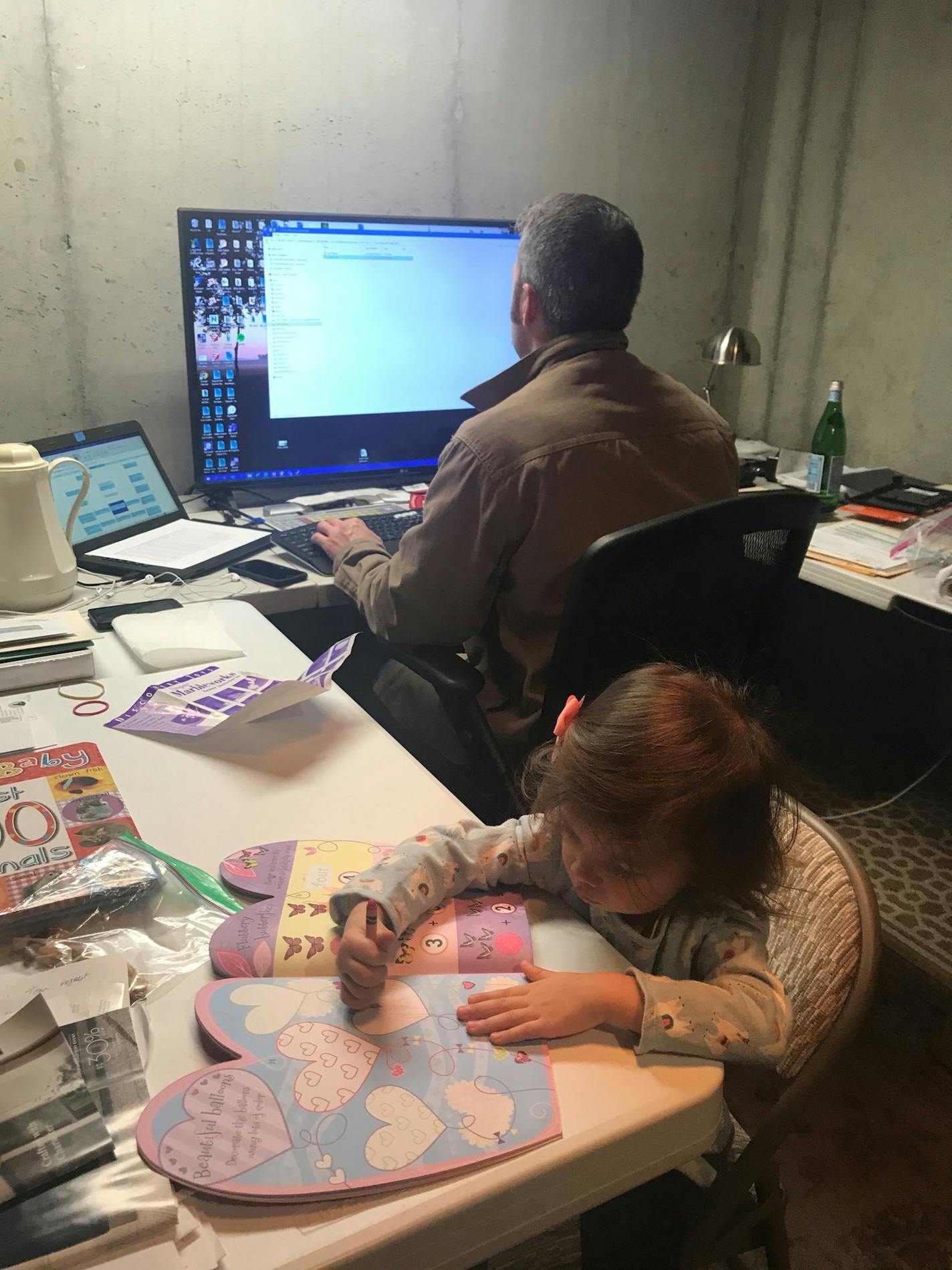 Mike Goetz, who works for a St. Paul mechanical contractor, has learned to keep focused on his work while keeping his children occupied. (Goetz family photo)