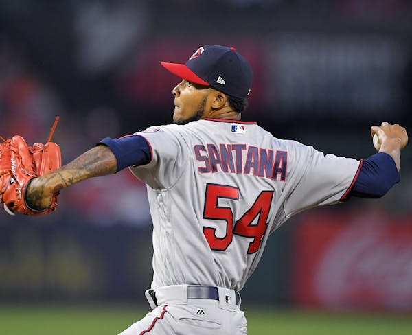 Minnesota Twins starting pitcher Ervin Santana throws to the plate during the first inning of a baseball game against the Los Angeles Angels, Saturday