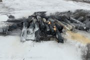 A BNSF train carrying ethanol and corn syrup derailed and caught fire in the town of Raymond, Minn., early on March 30, 2023.