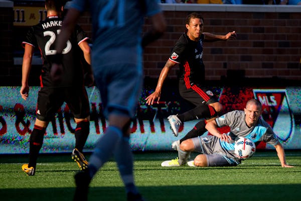 Minnesota United's Sam Cronin (right) and D.C. United's Nick DeLeon battled for the ball during the first half at TCF Bank Stadium on July 29.