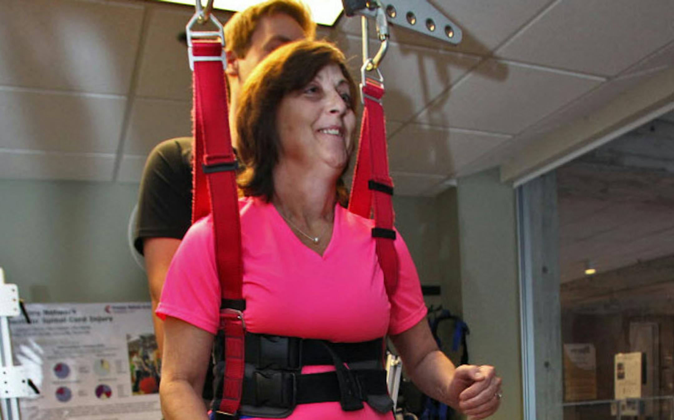 Becky Panser, of Champlin, is recovering from an injury with physical therapy sessions three times a week at Courage Center in Golden Valley, which is merging with Allina Health's Sister Kenny Rehabilitation Institute.