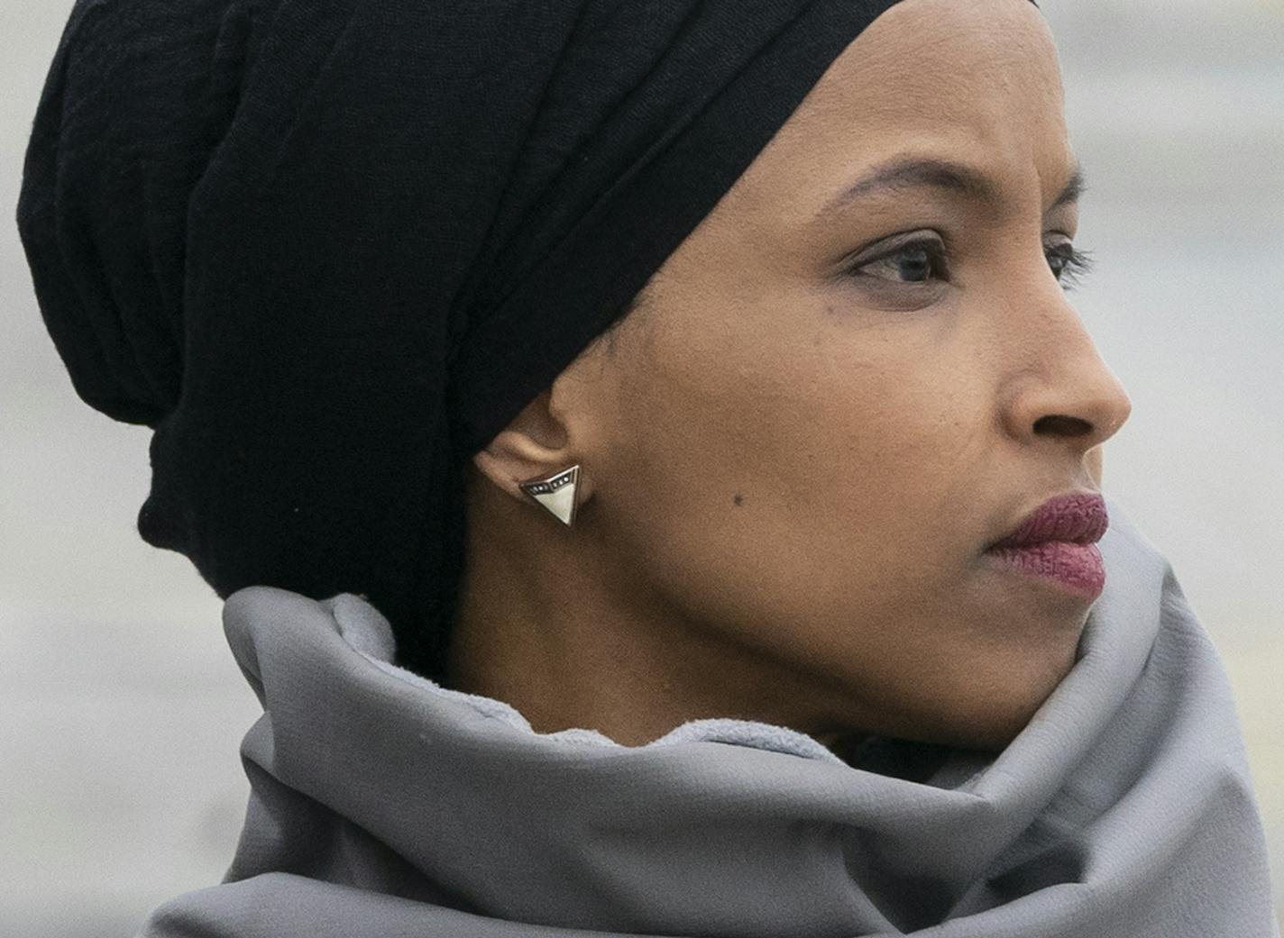 Rep. Ilhan Omar, D-Minn., stands with fellow Democrats as they rally outside the Capitol ahead of passage of H.R. 1, "The For the People Act," a bill which aims to expand voting rights and strengthen ethics rules, in Washington, Friday, March 8, 2019. The House passed a resolution to condemn anti-Semitism and other bigotry on Thursday following debate over Omar's recent comments suggesting House supporters of Israel have dual allegiances. (AP Photo/J. Scott Applewhite)