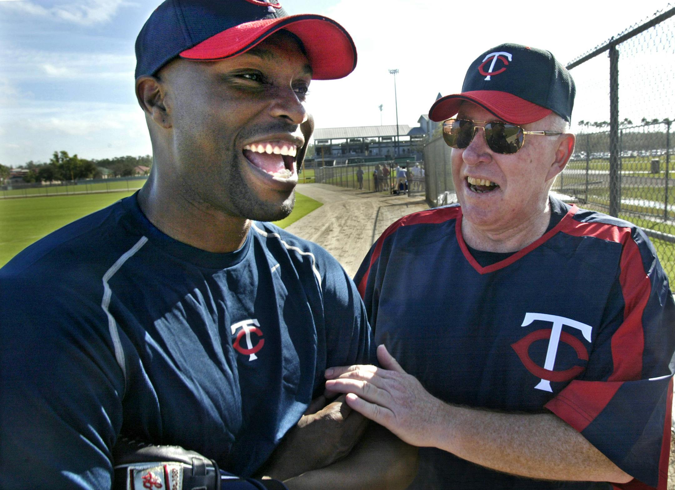 Torii Hunter, left, hit spring training former Twins manager Tom Kelly in 2006.