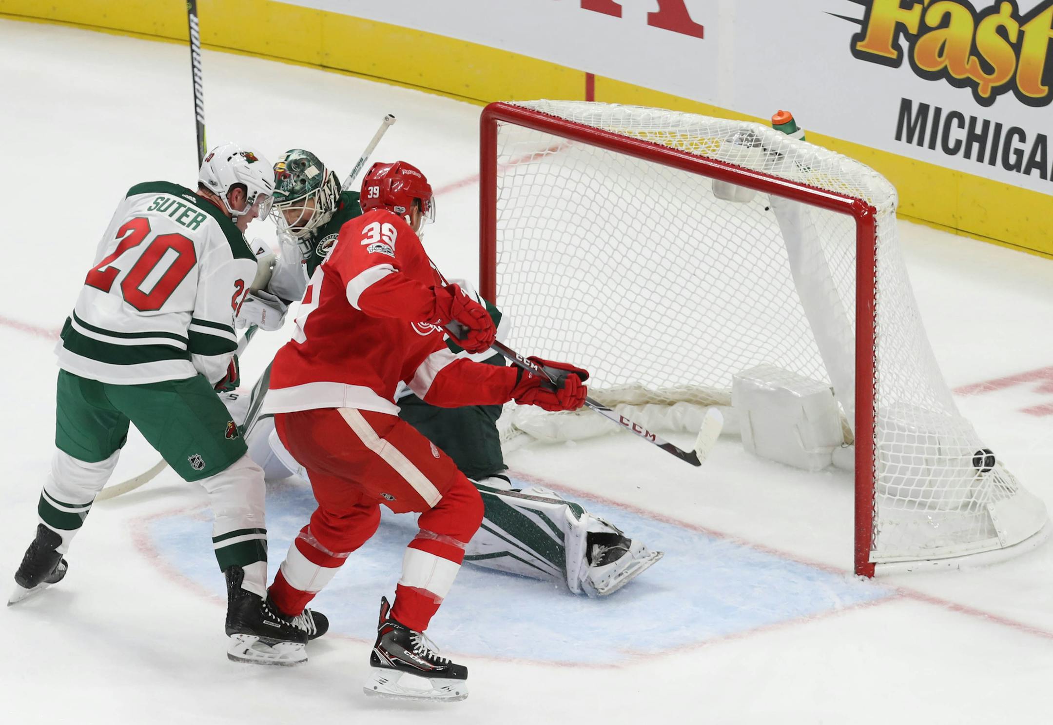 The Detroit Red Wings' Anthony Mantha scores the first goal at Little Caesars Arena against the Minnesota Wild's Devan Dubnyk during second-period action in Detroit on Thursday, Oct. 5, 2017. (Kirthmon F. Dozier/Detroit Free Press/TNS)
