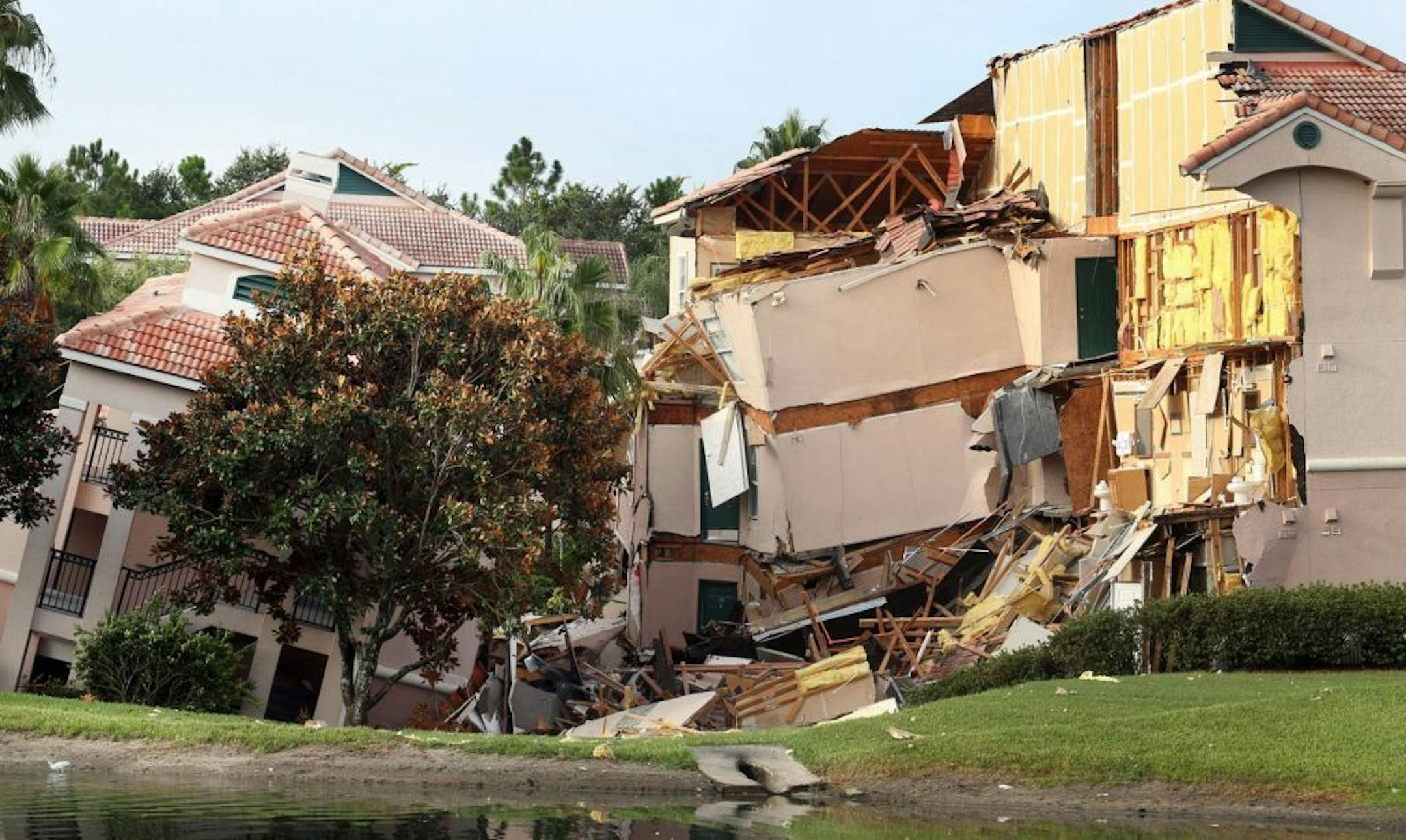 Buildings collapse into a sinkhole at the Summer Bay Resort on U.S. Highway 192 in Clermont, Florida, Monday, August 12, 2013.