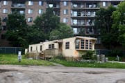 An abandoned manufactured home slated for demolition at Lowry Grove mobile home park Thursday, June 29, 2017, in St. Anthony, MN. Lowry Grove closed i
