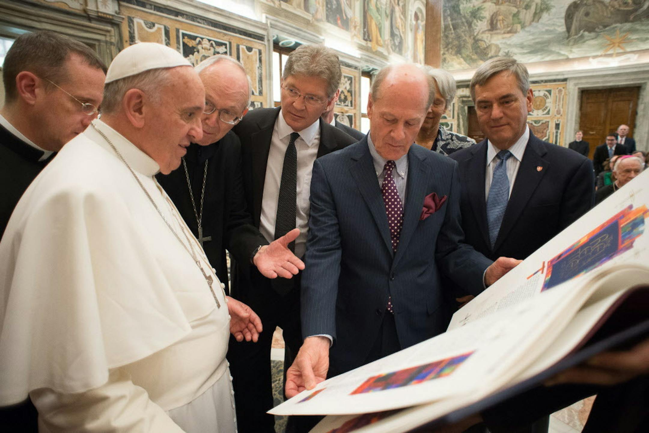 Pope Francis meets with delegation from St. John's University in Collegeville to receive the final volume of a limited edition of the university's famous Saint John's Bible. Pictured with Pope Francis (left to right) Abbot John Klassen, OSB, Saint Johnís Abbey; Michael Hemesath, president of Saint Johnís University; Donald Jackson, artistic director of The Saint Johnís Bible, and Katharine and Dan Whalen.