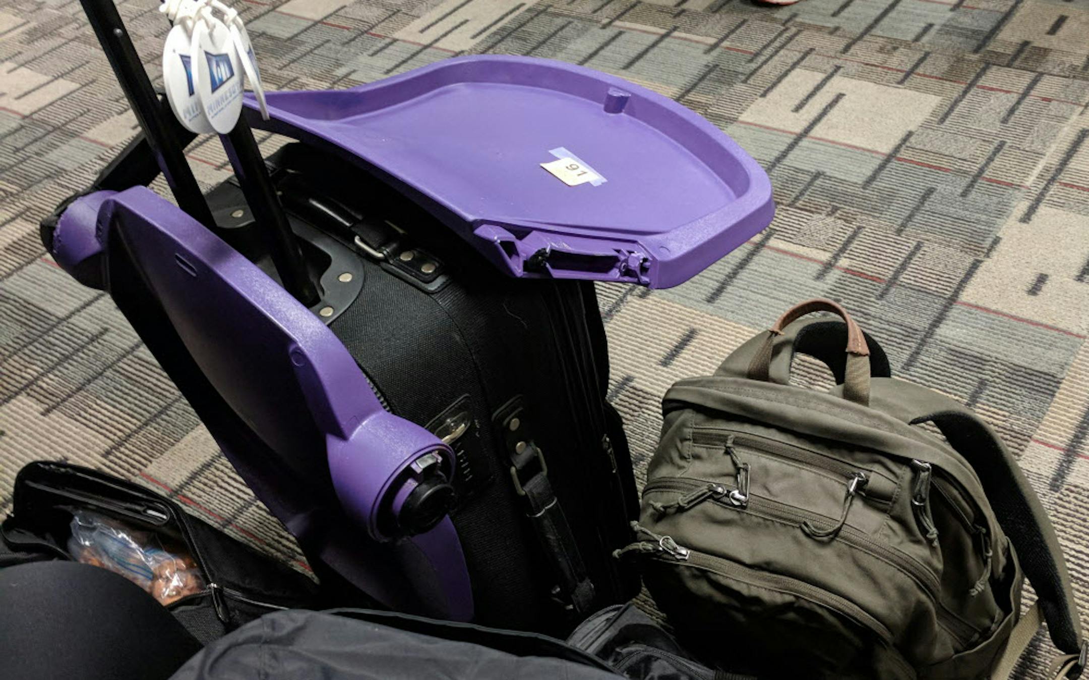 The stolen stadium seat, after getting through airport security, waiting to be carried on a plane.