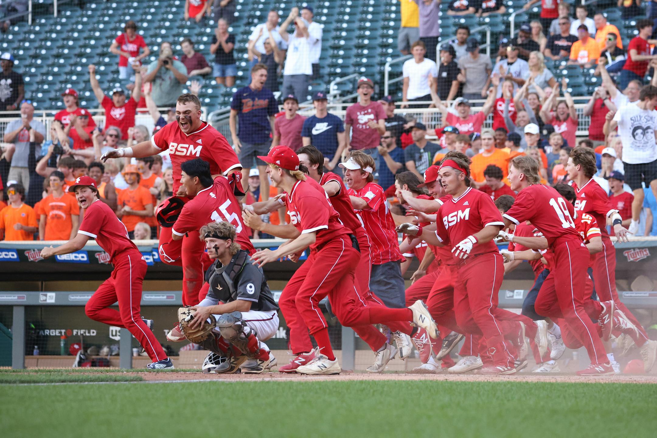 Benilde-St. Margaret's surrounds Mankato West catcher Zachary Kammerer celebrating their 4-3 win in extra innings. Photo by Cheryl A. Myers, SportsEngine
