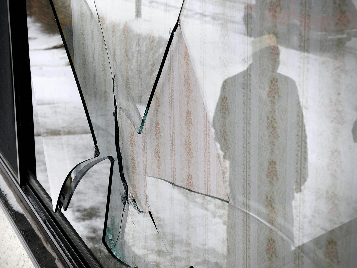 Dave Schwarz, dschwarz@stcloudtimes.com Imam Muhumed Ahmed looks at a window damaged Monday night at the Central Minnesota Islamic Center at 390 Fourth Avenue South. Imam Muhumed Ahmed looks at a window damaged by vandals at the Central Minnesota Islamic Center at 390 4th Ave South.